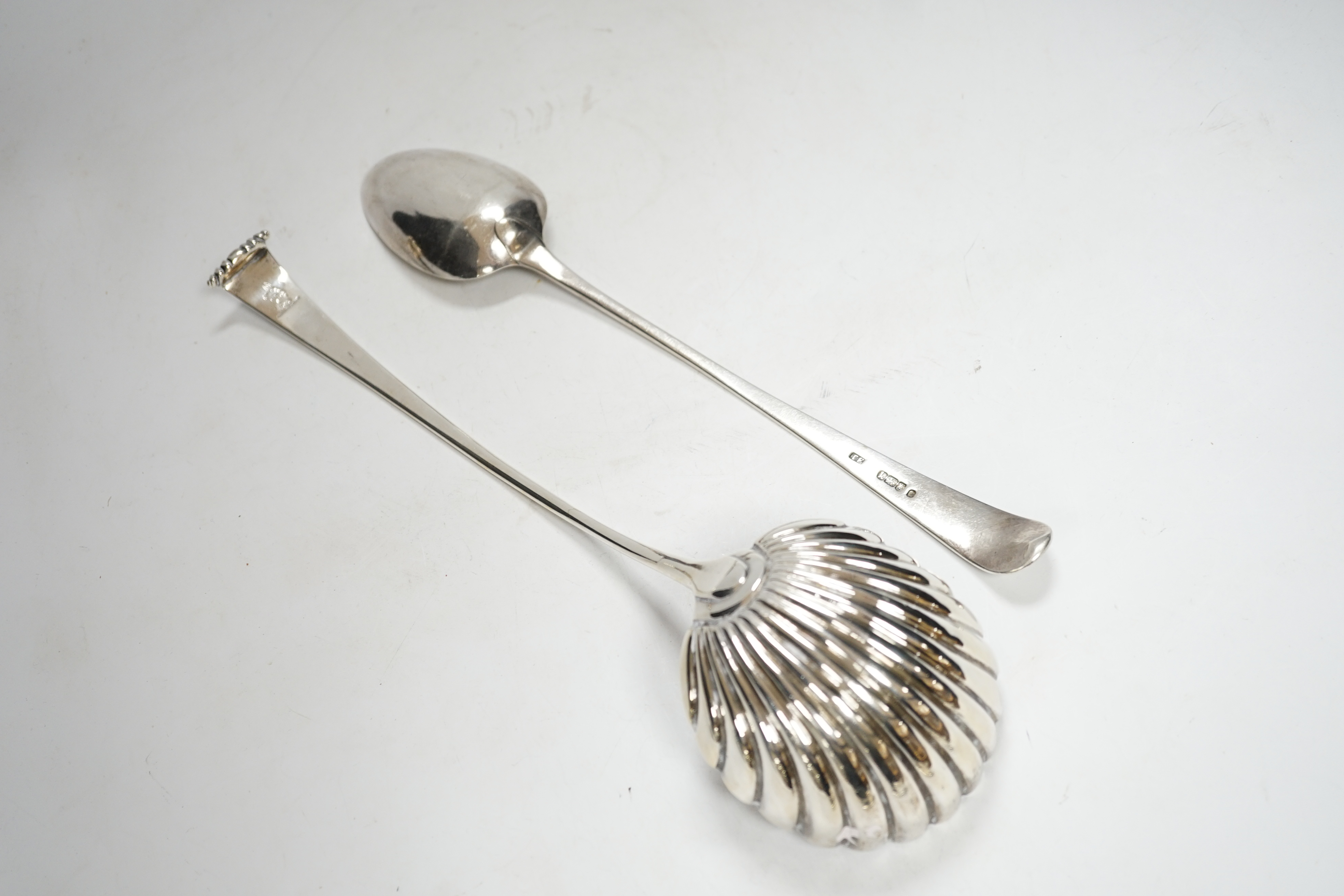 A George III silver Old English pattern basting spoon, Thomas Evans, London, 1785, 31.4cm, together with a white metal Onslow pattern soup ladle.